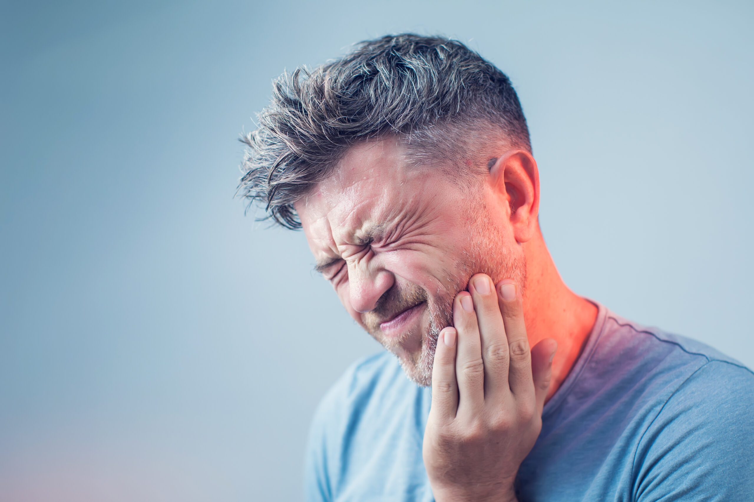 Man experiencing dental emergency and jaw pain in Casper, WY at Highland Family Dental