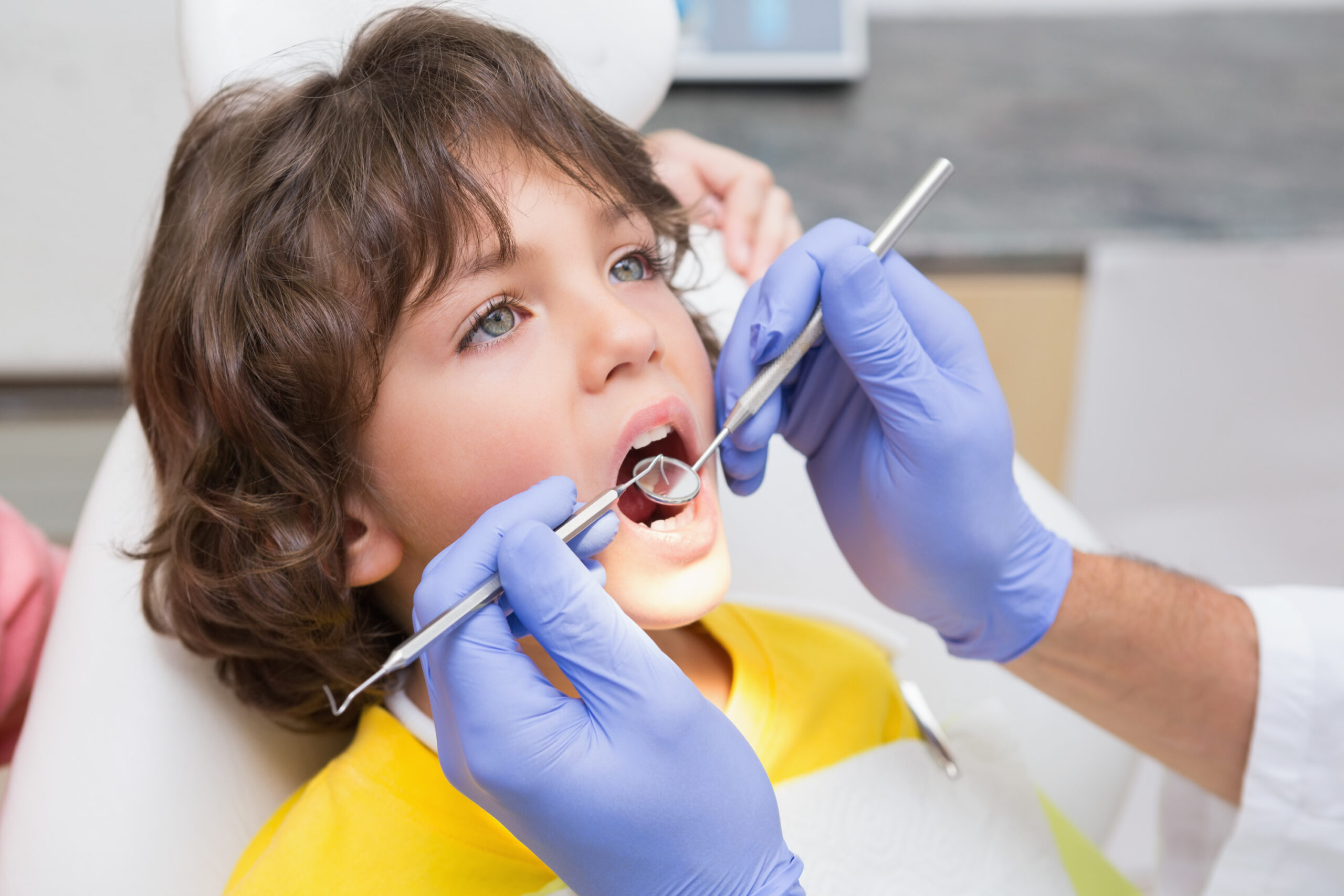 Young boy receiving a gentle teeth cleaning at Highland Family Dental in Casper, WY Young boy receiving a gentle teeth cleaning at Highland Family Dental in Casper, WY